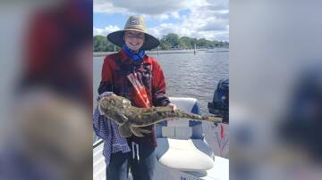 Junior angler Jacob Pope with a cracking 74cm flathead he caught on a live garfish in Limeburners Creek. Picture, supplied 