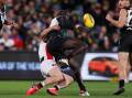 Aliir Aliir (r) played no further part in the game after this tackle from St Kilda's Jack Higgins. (Matt Turner/AAP PHOTOS)